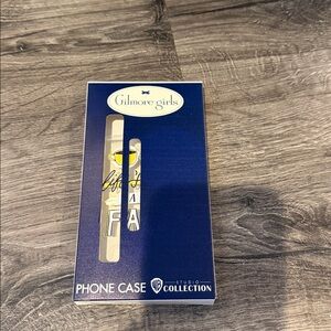 Warner Bros. "Gilmore Girls" branded phone case for an iPhone 14.